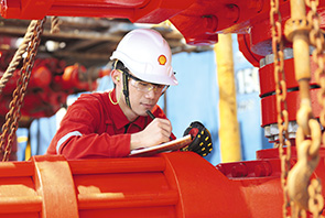 An engineer carrying out maintenance checks on a platform off the coast of Miri, Malaysia (photo)