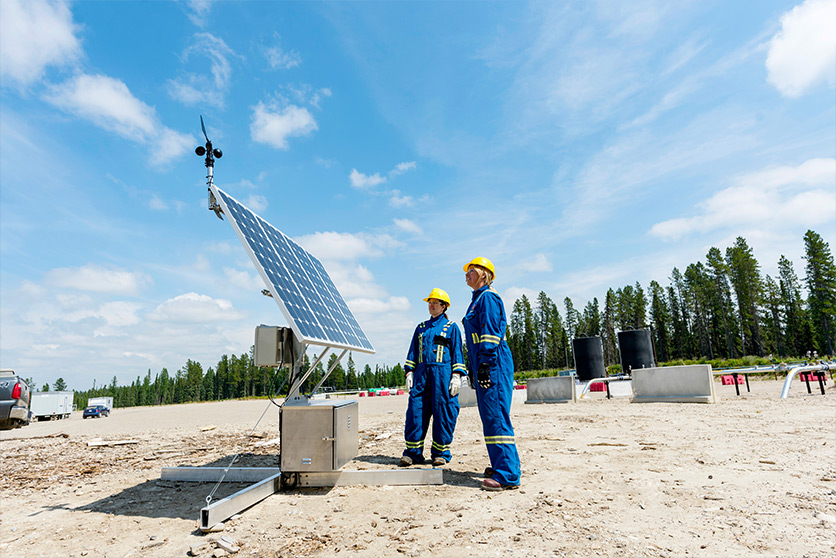 Employees during a routine inspection of the methane detection technology, Alberta, Canada (photo)