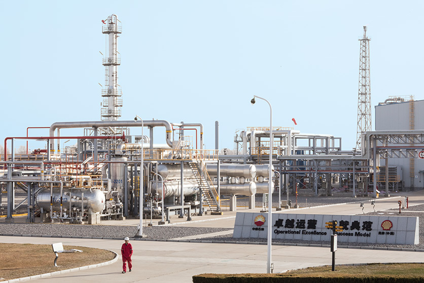 An employee walking outside the Changbei natural gas processing facility, China (photo)