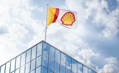 Exterior image showing the Pecten flag flying above Shell building (photo)