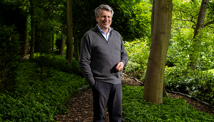 Ben Van Beurden, Chief Executive Officer of Royal Dutch Shell plc, standing outside among trees. (photo)