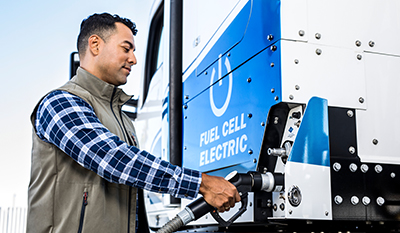 Man at a hydrogen fueling station in Los Angeles, USA (photo)
