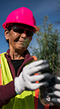 Shell employees participating in community service preparing lunch packages (photo)