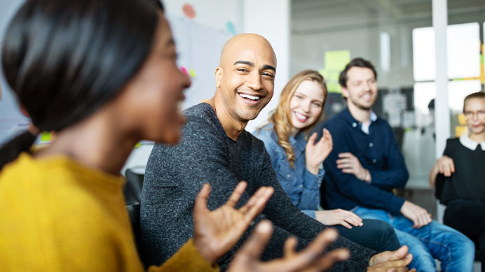Group of diverse business people talking in a meeting. Business team smiling during a meeting.