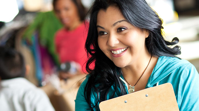 Young woman greating customer at a donation center
(photo)