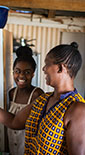mother and daughter cooking together at home in South Africa (photo)